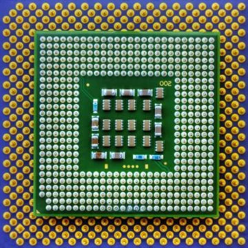 Technological background with computer motherboard and central processing unit Stock Photos
