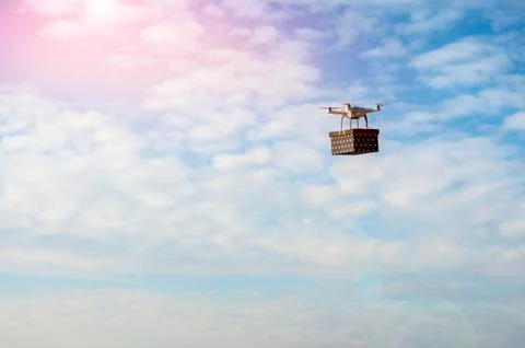 Technological delivery innovation - fast drone delivery concept above town Stock Photos