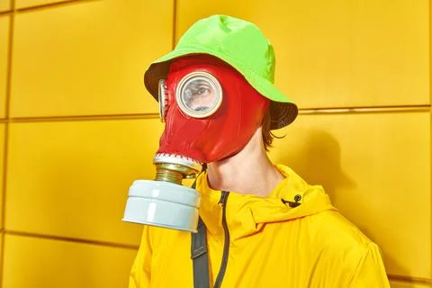 Technological disaster concept, air pollution. Portrait of a man in bright co Stock Photos