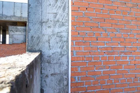Technological gap between the external monolithic frame and the brick wall is Stock Photos