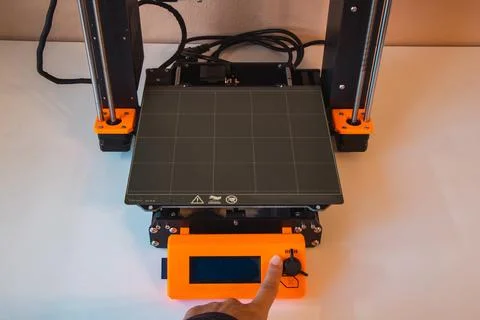 Technological hi-teg tool for making new things. A black and red 3D printer a Foto stock