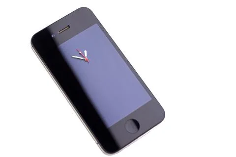 Technological innovation concept: phone with clock hands on the screen, short Stock Photos