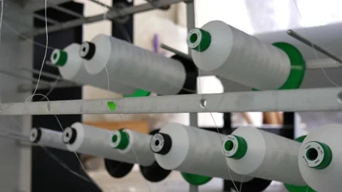 Technological installation in a textile factory where the thread on the spoo Stock Footage 148341469