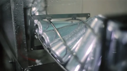 Technological line for bottling of beer in brewery. Empty aluminum beer cans are Stock Footage 129305685