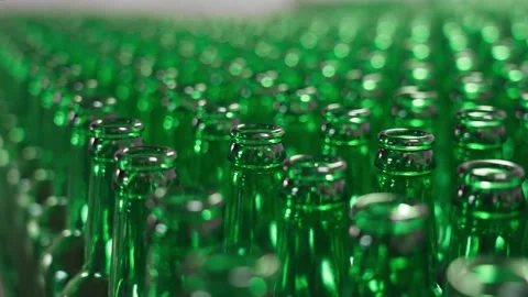 Technological line for bottling of beer in brewery. Empty brown bottles in a 库存影片 151813579