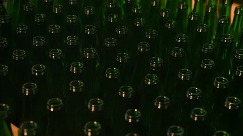 Technological line for bottling of beer in brewery. Empty brown bottles in a Stock Footage 201114059