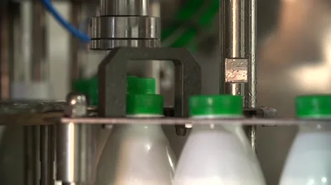 Technological line of spill of yogurt. close-up shot of twisting of traffic jams Stock Footage 58328896