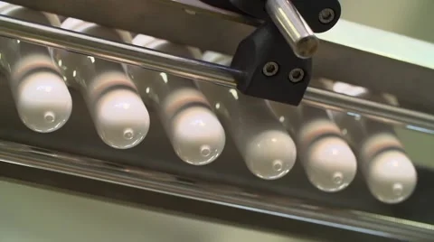 Technological line of spill of yogurt. close-up shot of preparation of a bottle Vídeos de archivo 58329809