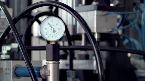Technological line of spill of yogurt. pressure manometer close-up shot Stock-Footage 58328089
