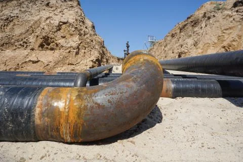 Technological pipelines DN50 and DN 150 make a turn by means of bends in the  Stock Photos