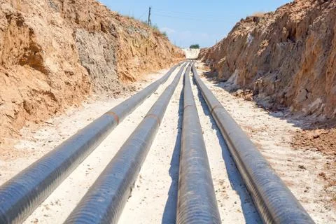 Technological pipelines DN50 and DN 150 make a turn by means of bends in the  Stock Photos