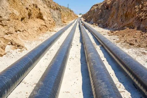 Technological pipelines DN50 and DN 150 make a turn by means of bends in the  Stock Photos