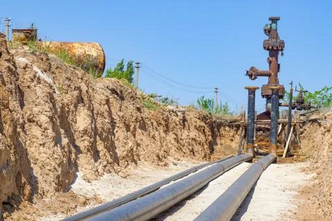 Technological pipelines DN50 and DN 150 make a turn by means of bends in the  Stock Photos