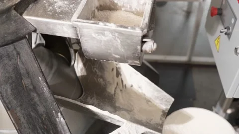 Technological process of product molding. Forming dough in a dough rounder Stock Footage 235594071