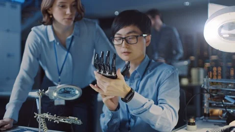 Technological Prosthetic Robot Arm is Closely Tested by Professional Specialists Stock Footage 105344016