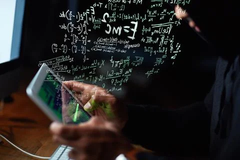 Technologically fluent. a young hacker cracking a computer code in the dark. 스톡 사진