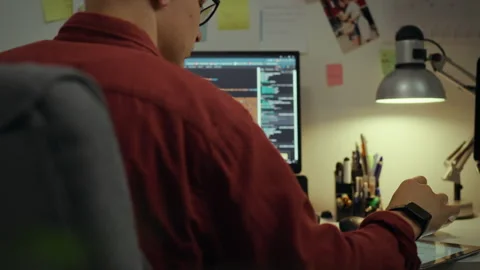 Technologies. An experienced specialist, using intelligence programs, making Stock Footage 281106428