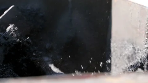 Technologies. A large mixer will actively stir the black substance for further Stock Footage 178495025