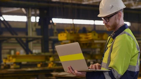 Technologist with laptop in his hands at manufacturing plant Video stock 106570965