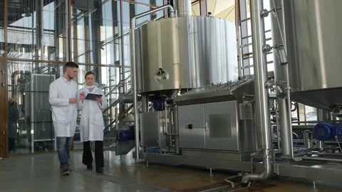 Technologists walk through the production hall 库存影片 175803877