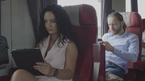 Technology addiction of millennial office dressed man and woman commuters on  Stock Footage 102586655