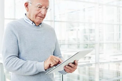 Technology allows him to keep track of his whole business Stock Photos