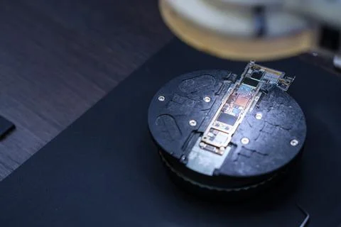 Technology and Circuits Are Displayed on a Black Circular Surface With a Stock Photos