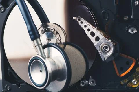 Technology and data recovery concept, stethoscope on old dusty disassembled h Stock-Fotos