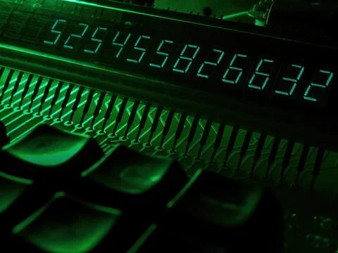 Technology and electronics concept. Electronic scoreboard with numbers. Stock Photos