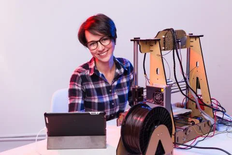 Technology and engineering concept - Female engineer working in the lab, he is Stock Photos