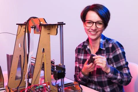 Technology and engineering concept - Female engineer working in the lab, he is Stock Photos