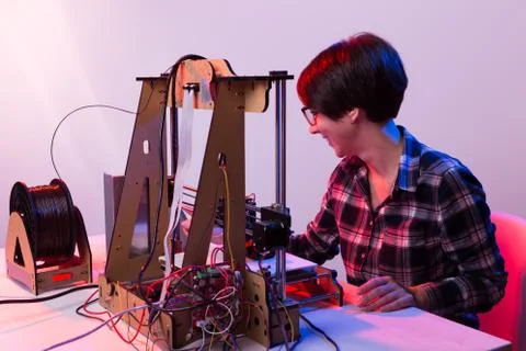 Technology and engineering concept - Female engineer working in the lab, he is Stock Photos
