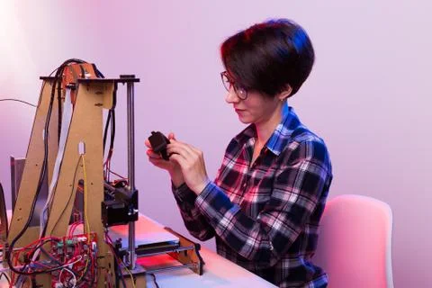 Technology and engineering concept - Female engineer working in the lab, he is Stock Photos