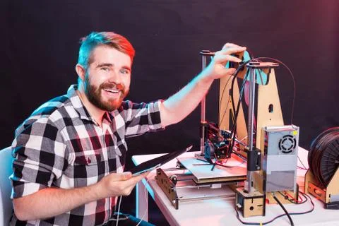 Technology and engineering concept - Male engineer working at night in the lab Stock Photos