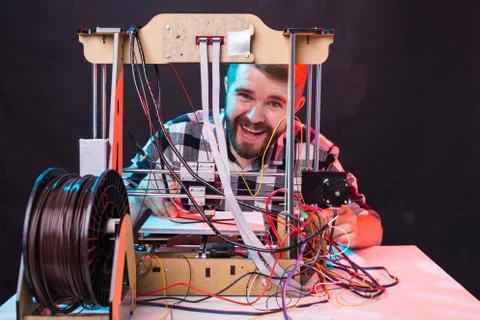 Technology and engineering concept - Male engineer working at night in the lab Stock Photos