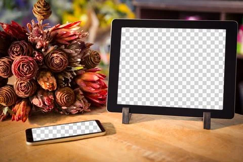Technology and flowers on table Illustrazione stock