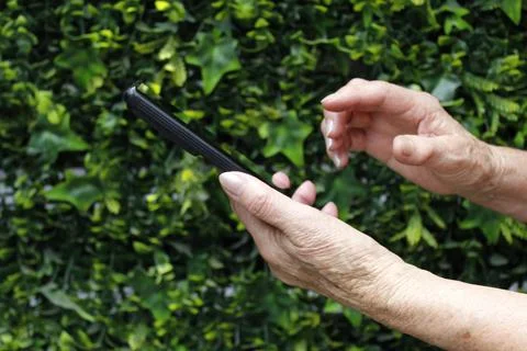 Technology and mobile communication for the elderly Stock Photos
