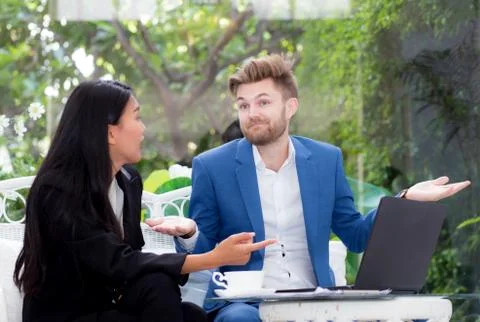 Technology and office concept - two business man and woman with laptop - tabl Stockfoto's