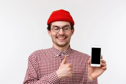 Technology and people concept. Close-up portrait geeky cute bearded man with Stock Photos