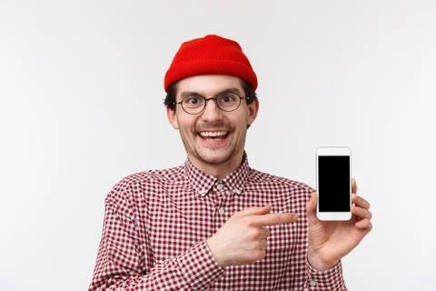 Technology and people concept. Close-up portrait happy smiling young bearded Stock Photos