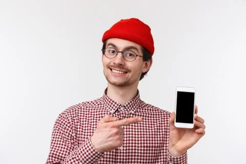 Technology and people concept. Close-up portrait young modern man with beard in Stock Photos