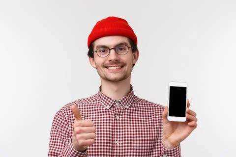 Technology and people concept. Close-up portrait satisfied handsome bearded man Stock Photos