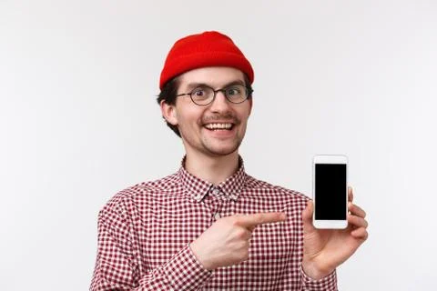 Technology and people concept. Close-up portrait excited pleased young man in Stock Photos