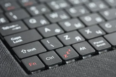 Technology background. Closeup of new black laptop keyboard Stock Photos