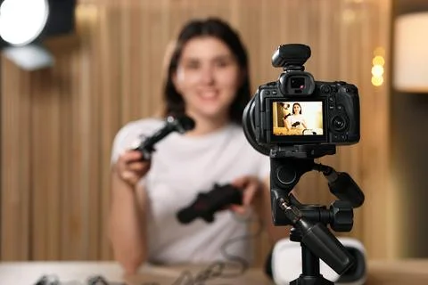 Technology blogger explaining something while recording video at home, focu.. Stock Photos