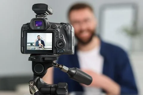 Technology blogger explaining something while recording video at home, focu.. Stock Photos