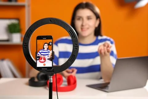 Technology blogger explaining something while recording video at home, focu.. Stock Photos