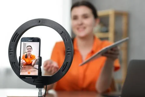 Technology blogger explaining something while recording video at home, focu.. Stock Photos