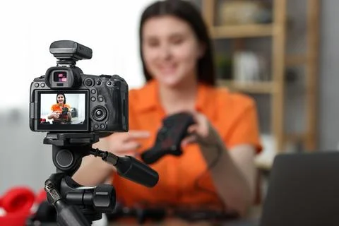 Technology blogger explaining something while recording video at home, focu.. Stock Photos