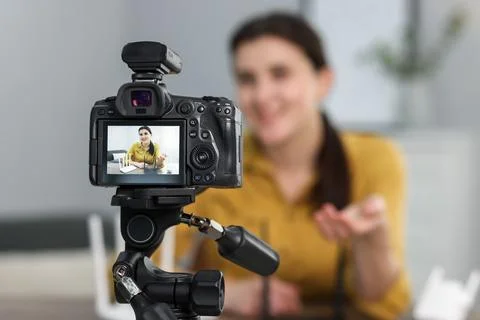 Technology blogger explaining something while recording video at home, focu.. Stock Photos